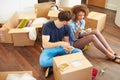 Couple Moving Into New Home Enjoying Takeaway Meal Royalty Free Stock Photo