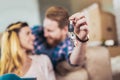 Couple moving new home. Couple showing keys to new home Royalty Free Stock Photo