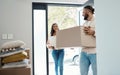 Couple moving, new house and carrying boxes with property, man and woman in real estate as homeowners. Mortgage, happy Royalty Free Stock Photo