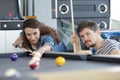 couple n billiard hall playing pool Royalty Free Stock Photo