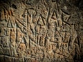 Couple name carved in cement vintage wall, true love of Anwar and Anusha