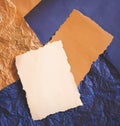 Couple of natural brown and white blank sheets on a crumpled blue and brown paper. Design templates with free copy space for text Royalty Free Stock Photo