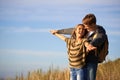 Couple, nature and love with sunshine, smile and outdoor with romance and honeymoon celebration. Happiness, hiking and