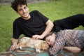 Couple in the nature with puppy of australian shephered