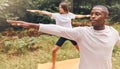 Couple, nature and yoga of a man and woman in workout exercise for the mind, body and spirit outdoors. Interracial Royalty Free Stock Photo