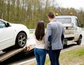 Couple near broken car on a roadside Royalty Free Stock Photo