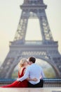 Couple near the Eiffel tower in Paris, France Royalty Free Stock Photo