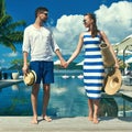 Couple near poolside Royalty Free Stock Photo