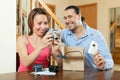 Couple with new compact digital camera Royalty Free Stock Photo