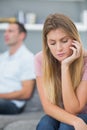 Couple not talking after a dispute on the couch with woman looking down Royalty Free Stock Photo