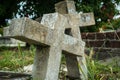 Couple of old gravestones in christian cemetery leaning together as symbol of eternal love