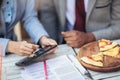 Couple ordering food on tablet computer in restaurant