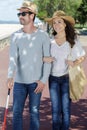 Couple out for walk man visually impaired