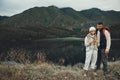 Couple, outdoor and adventure with mountain, smartphone and gps on vacation, getaway and hike. Man, woman and trekking Royalty Free Stock Photo