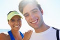 Couple, outdoor and portrait in beach, exercise and fitness with smile, training and sunrise for run. Man, woman and Royalty Free Stock Photo