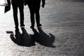 Silhouettes of two people walking down the street Royalty Free Stock Photo