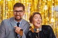 Couple over gold with photo booth accessories on party Royalty Free Stock Photo