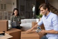 Couple pack their personal belongings preparing for relocation