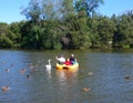 A couple in a paddleboat on the avon river flowing through stratford ontario Royalty Free Stock Photo