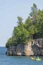 Couple paddling canoe near Ellingson Island on Lake Superior near Split Rock Lighthouse