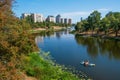 Couple paddling kayaks on the tranquil waters of the river enjoying the cityscape of Kyiv, Ukraine