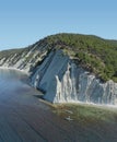 Couple Paddling on SUP Board Close to Beautiful Coastline.