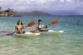 Couple paddling surfskis