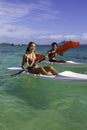 Couple paddling surfskis