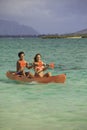 Couple paddling their kayak Royalty Free Stock Photo