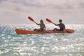 Couple paddling their kayak Royalty Free Stock Photo