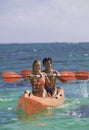 Couple paddling their kayak Royalty Free Stock Photo