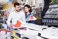 Couple in paint supplies store Royalty Free Stock Photo