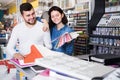 Couple in paint supplies store Royalty Free Stock Photo