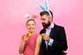 Couple painting eggs for Easter. Rabbit Family celebrate Easter. Happy holidays. Bunny ears. Royalty Free Stock Photo