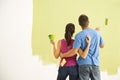 Couple painting home.