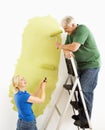 Couple painting wall. Royalty Free Stock Photo