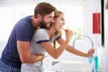 Couple In Pajamas Brushing Teeth In Bathroom Royalty Free Stock Photo