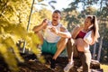 Couple in the park having break and eating healthy meal. Salad and apple Fruit day Royalty Free Stock Photo