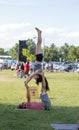 A couple in the park practice arcayoga during the farmers market