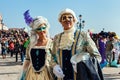 Couple of participants wear costumes and masks during carnival in Venice