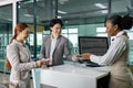 Couple passengers are getting their boarding pass from airline ground crew at departure gate into the airplane for final Royalty Free Stock Photo