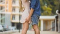 Couple passionately embracing in city street, tender relationship, safe sex Royalty Free Stock Photo