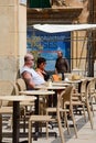 Couple at a pavement cafe, Valletta.