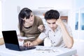 Couple paying bills online