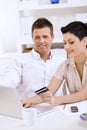Couple paying with credit card Royalty Free Stock Photo