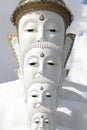 Couple peaceful white buddha statues sitting well alignment and decorating wonderful attractive mirror