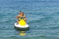 Couple people having fun with Jetski on open sea Royalty Free Stock Photo