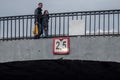 A couple of people walking on the bridge. motion blur Royalty Free Stock Photo