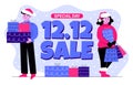 A couple of people, woman and man in christmas hats, with shopping bags and gift boxes. Great sale 12.12. Discounts, stocks. Royalty Free Stock Photo
