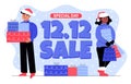 A couple of people, woman and man in christmas hats, with shopping bags and gift boxes. Great sale 12.12. Discounts, stocks. Royalty Free Stock Photo